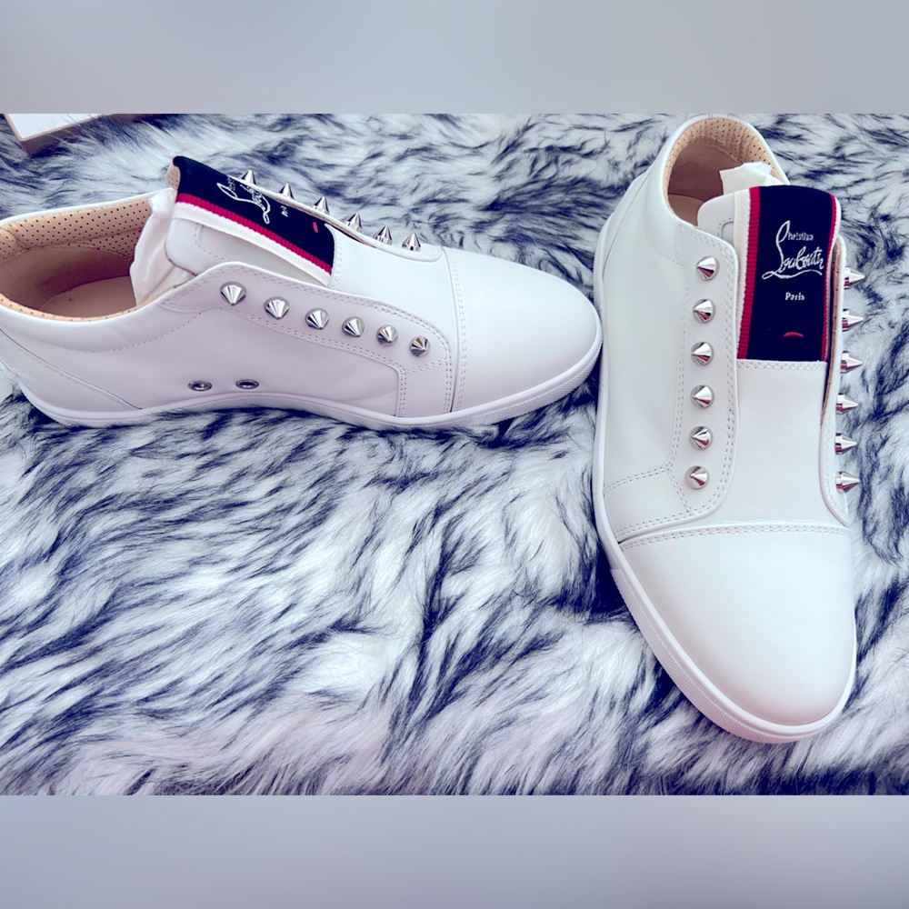 White Louboutin sneakers